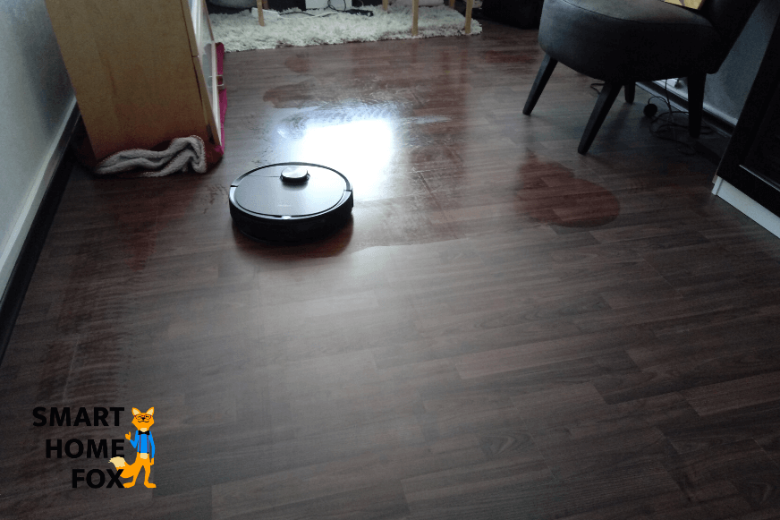 Robot vacuum cleaner with mopping function cleans the floor.